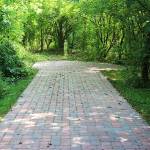 Stove paver walkway with Statue at Brian Manor Bed & Breakfast